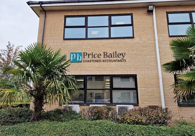 Price Bailey signage with acrylic lettering and logo fitted to brick wall via locators