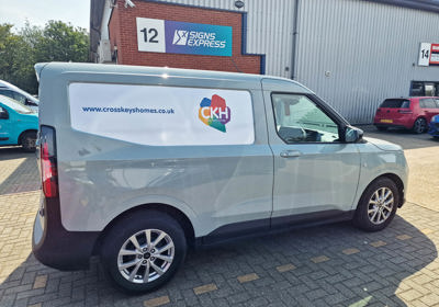 Livery graphic for Cross Keys Homes with an filled panel in white vinyl and company branding, standing out from the metallic paintwork