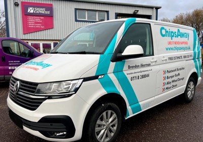 Black, Orange & Blue Cut Vinyl Graphics & Stripes On A White VW Transporter