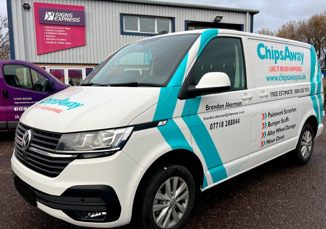 Black, Orange & Blue Cut Vinyl Graphics & Stripes On A White VW Transporter