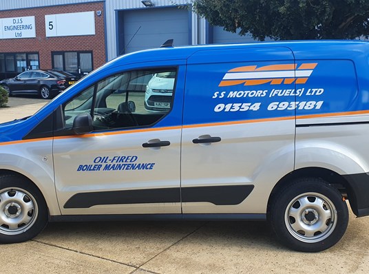Silver van half wrapped with blue, orange and white vinyl