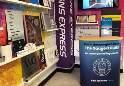 Exhibition Counter With Shaped Wood Effect Top And Digital Printed Wrap Graphics 