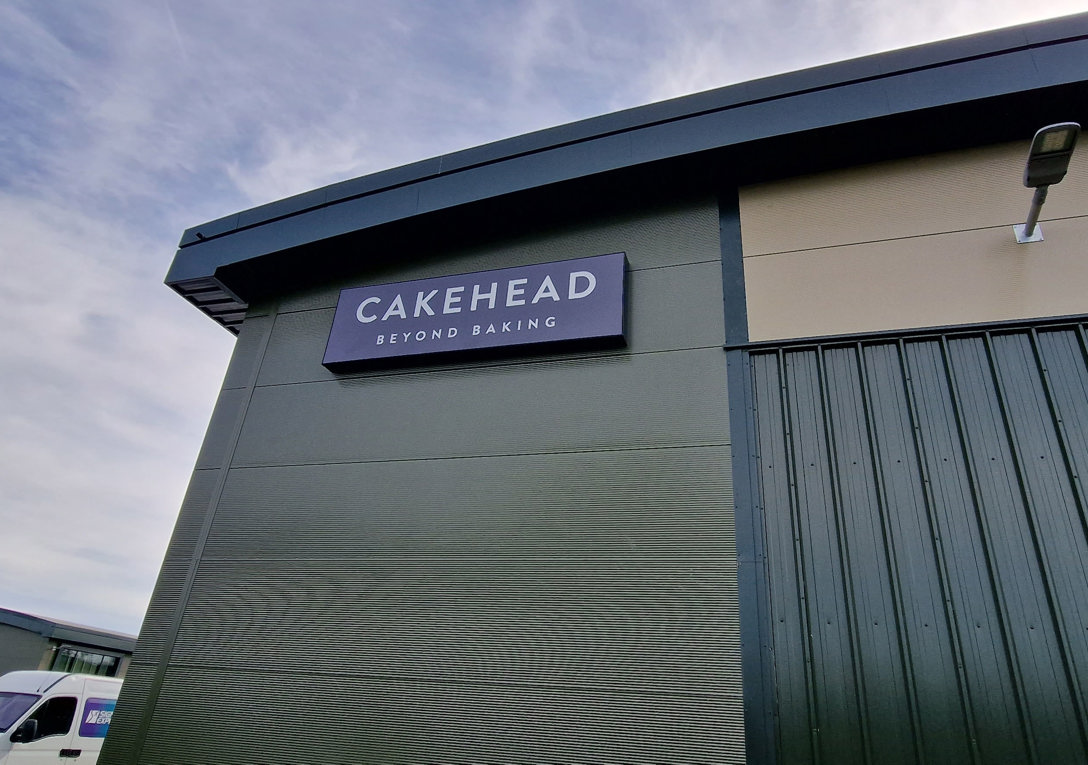 Illuminated warehouse Flexface sign for  Cakehead