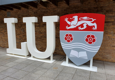 Lancaster University free standing aluminium letters with Sheild