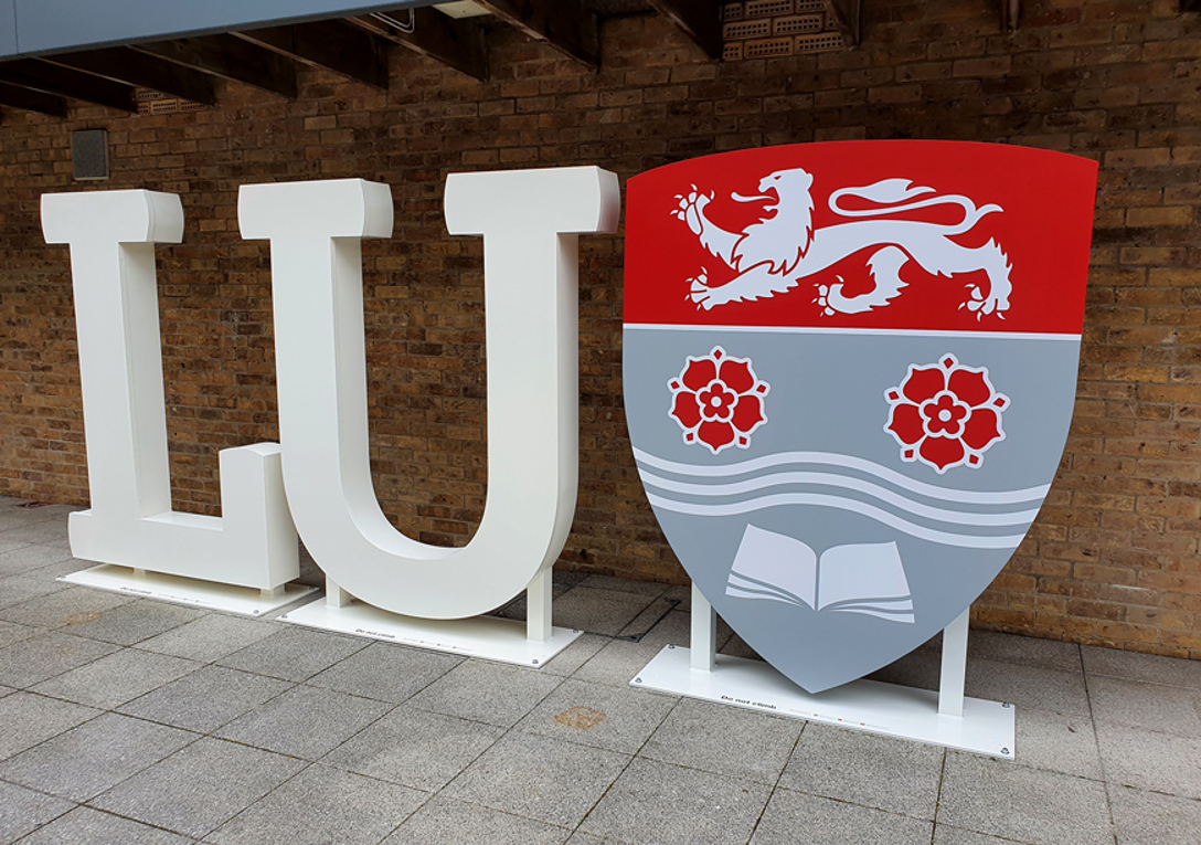 Lancaster University free standing aluminium letters with Sheild