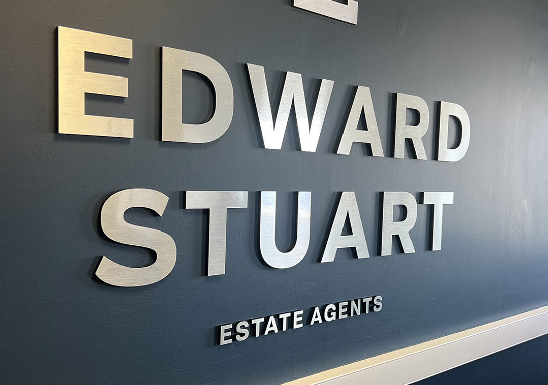 Brushed aluminium lettering and logo wall sign for Edward Stuart