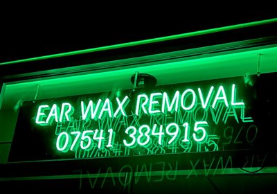 Neon Style Sign With Green Illumination