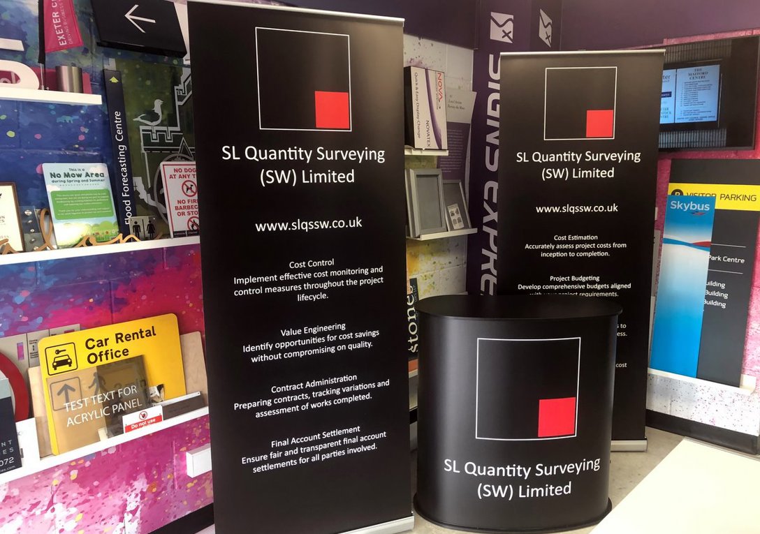 Freestanding Display Counter With Shaped Top & Budget Roll Up Banner Stands