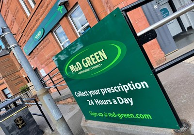 M & D Green Stepps pharmacy, railings sign