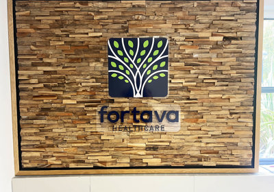 Fortava acrylic wall sign onto distressed wooden panels wall feature