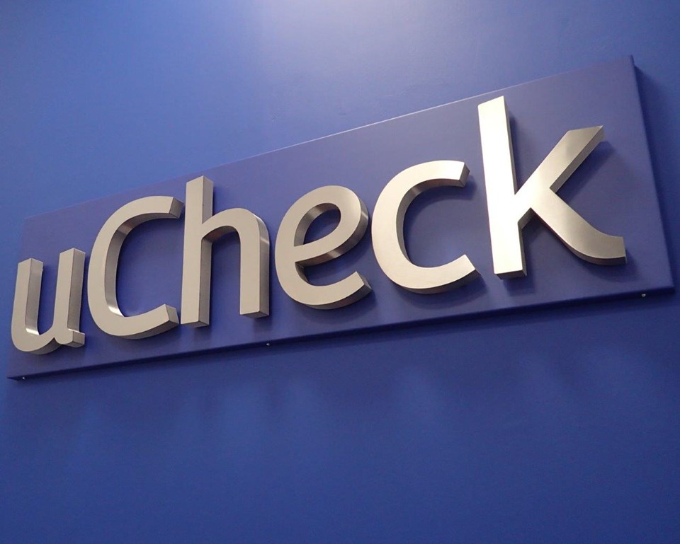 Interior Display Signs Built Up Brushed Stainless Steel Letters With White Halo Illumination Mounted On An Aluminium Composite Sign Tray For UCheck, Exeter