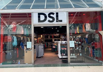 Acrylic lettering onto glossy white panel shop signage for DSL